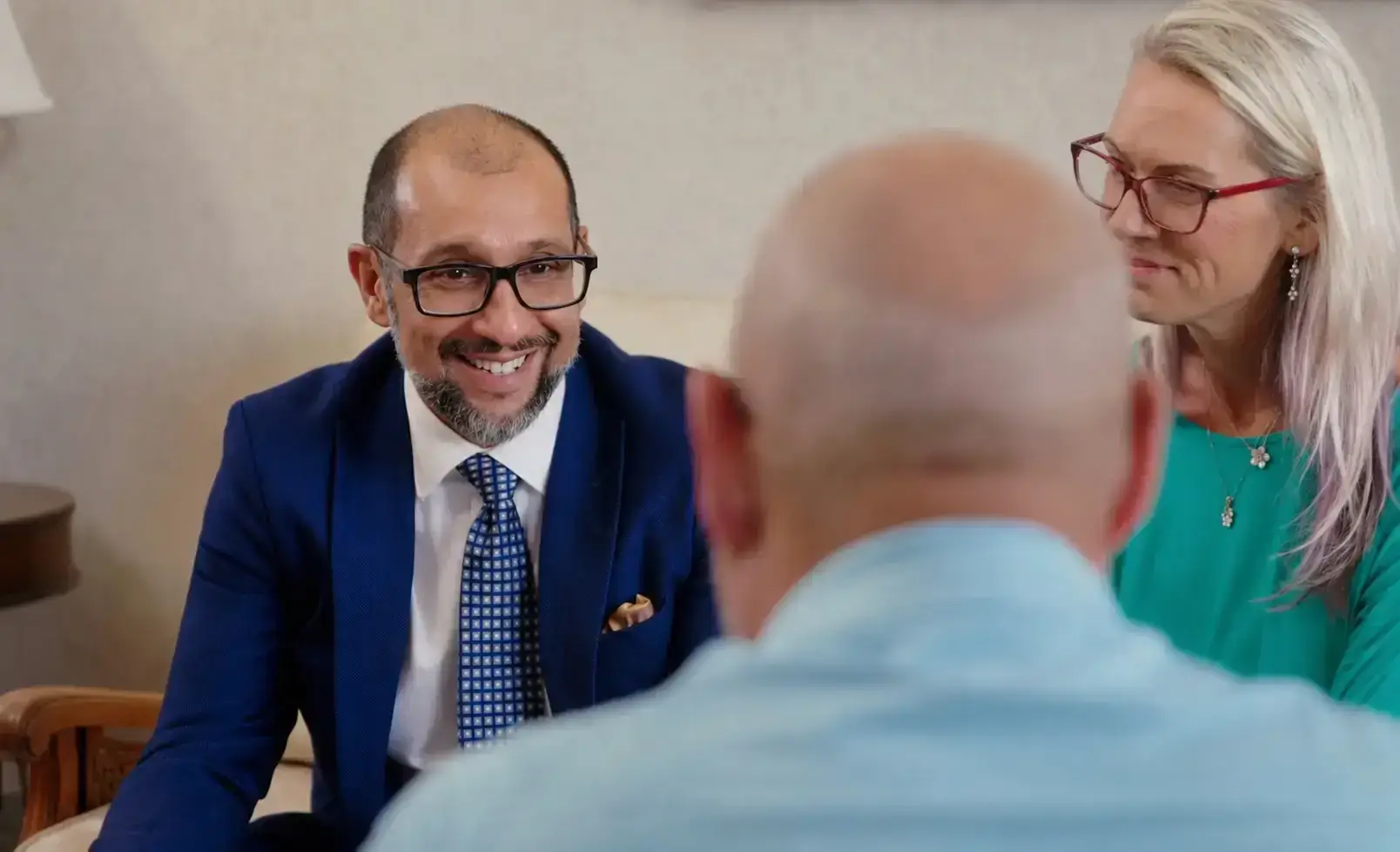 Ali Kamalzadeh meeting with two people across a table
